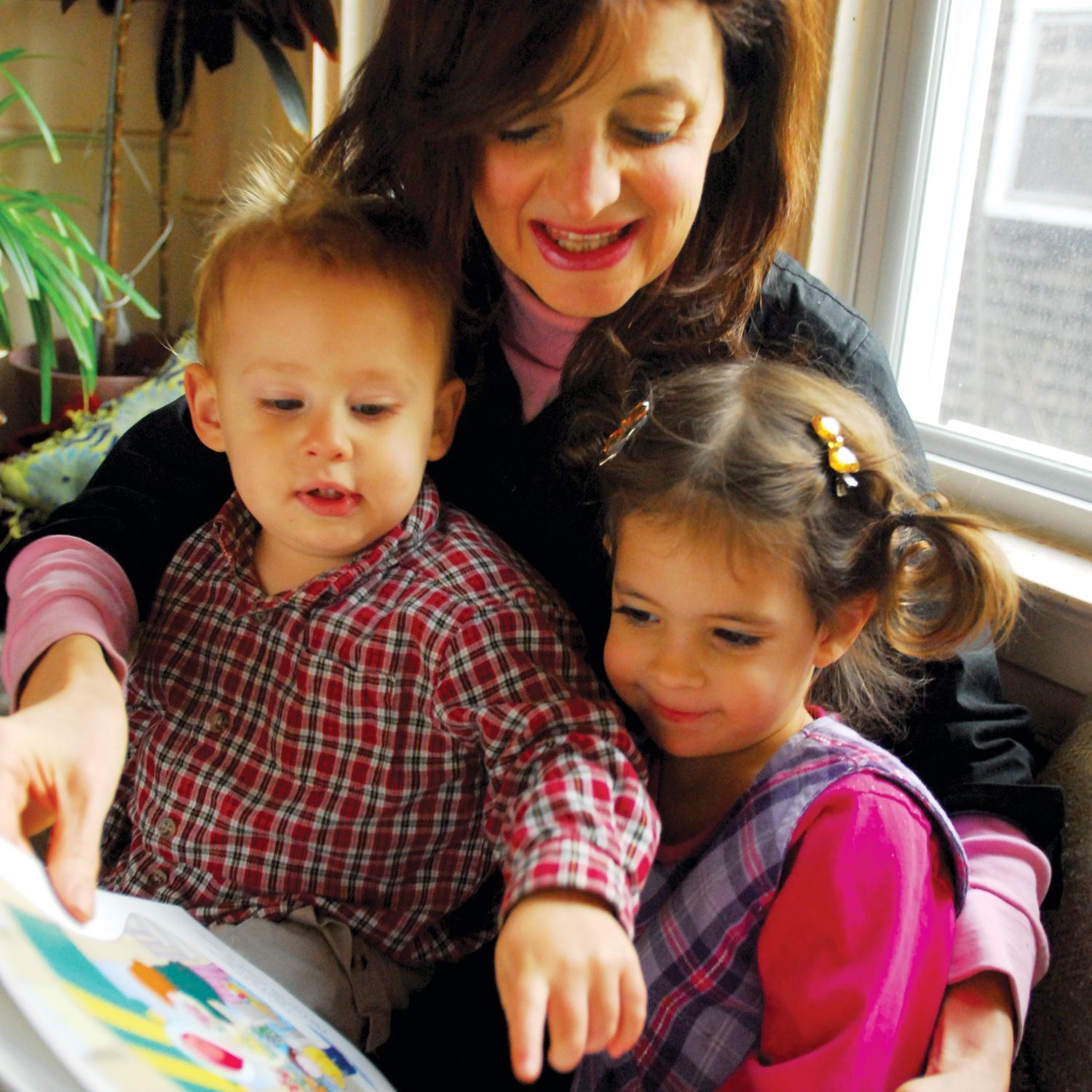 woman reading to children